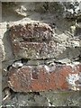 Damaged benchmark on Well Street, Menai Bridge