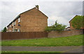 Wall, fence and housing on south side of Trent Road