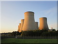 Cooling towers lit by the evening sun