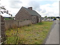 Boarded up old stone built cottage on the Coach Road