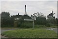 Fingerposts and green triangle at the road to Chipping Campden