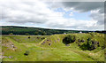 Grassed-over quarry north-west of Miln House Farm