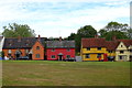 TL8352 : Colourful houses across the green, Hartest by JThomas