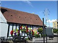 Hanging baskets outside The George Staples at Blackfen