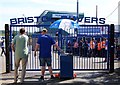 Programme seller by the gates at the Memorial Stadium