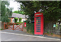 Elizabeth II postbox and telephone box on the A519, Slindon