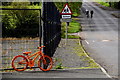 Orange coloured bicycle, Beragh