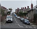 Vehicle-lined road in suburban Barry