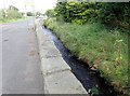 The Camlough River flowing alongside the A25