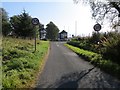 NN9009 : Minor road joining the B8081 at Blackford Level Crossing by Peter Wood