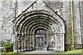 St. Germans Priory Church: Norman west doorway with seven weathered orders