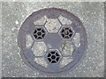 SH6874 : Coal hole cover on Station Road, Llanfairfechan by Meirion