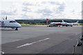 NH7651 : Planes at Inverness Airport by Bill Boaden
