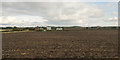 View over ploughed field towards Low Middle Moor Farm