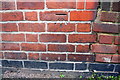 Benchmark on #1 Newland Road (Leicester Causeway face)