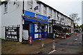 Parade of shops, mostly convenience stores