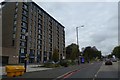 Bus stop and shelter by A38 outside tower block