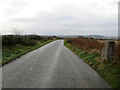 Minor road at the Hilton on Dunlugas Triangulation Pillar