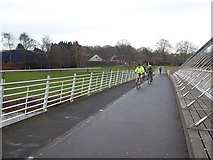 SE6050 : Cyclists on York Millennium Bridge by Oliver Dixon