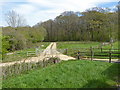 Gated track towards woodland