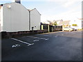 Numbered parking bays set back from the north side of Brecon Road, Abergavenny