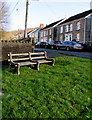 Benches on grass on a Crynant corner 