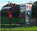 TA2539 : Elizabeth II postbox and telephone box on Seaside Road, Aldbrough by JThomas