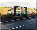 X8 bus stop and blue shelter in Pantyffordd