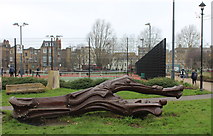 TQ3277 : Log carving in Burgess Park by Robert Eva