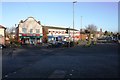 Shops set back from Wigton Road at Orton Road junction