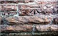 Benchmark on School House on North side of A66