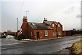 Edenhall Cottage on NW side at A686