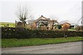 Bungalow on NW side of road at Stoneygarth