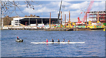 TQ2376 : Rowing past the Stadium by Des Blenkinsopp