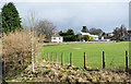 Field below hospital and school