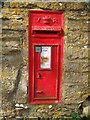 An old post box in an old wall