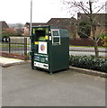 Dark green donations bin above Henllys Village Road, Cwmbran