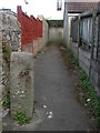 An old gatepost in a modern lane