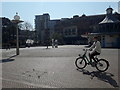 SZ0891 : Bournemouth: a masked man cycles across The Square by Chris Downer