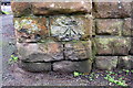 Benchmark on corner pier of wall bounding #418 Woodborough Road