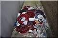 Discarded wreaths from Hounslow War Memorial