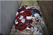 TQ1375 : Discarded wreaths from Hounslow War Memorial by Ian S