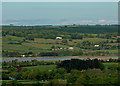 A view across the River Taw towards hills around Berry Down and East Down