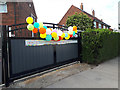 Party balloons on a gate during lockdown