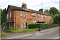 Row of four houses on NE side of Knighton Lane East