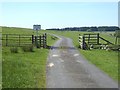NY9882 : Cattle grid on road approaching St Mary's Pike by Oliver Dixon