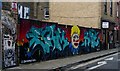 Tower Hamlets: Graffiti hoarding, Fashion Street