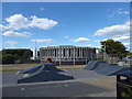 Looking over a skateboard rank towards a water board building