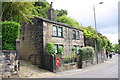 GR letterbox in wall fronting house at SE end of Commercial Street