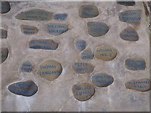 NT9464 : Painted Pebbles at Eyemouth Community Memorial Wall by Jennifer Petrie